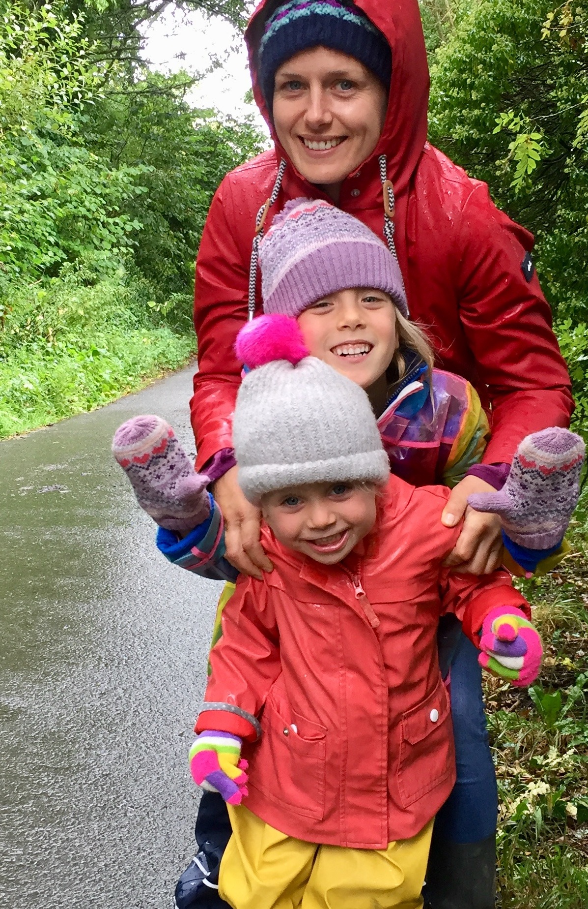 Sally with her two daughters on a woodland walk