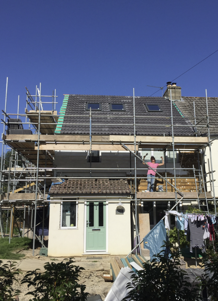 Sally on scaffolding during the house extension and loft conversion
